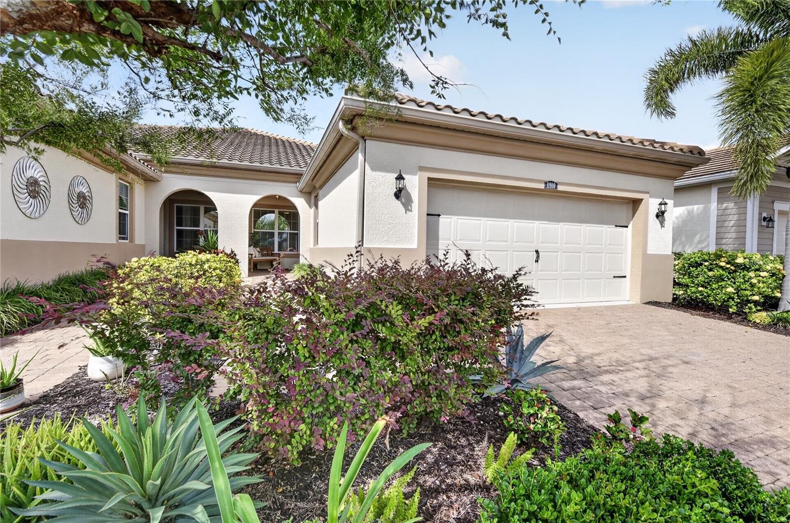 EXTENDED PATIO, PEACEFUL PRESERVE VIEWS, OFFERED FURNISHED, AND RESORT-STYLE LIVING IN RENAISSANCE AT WELLEN PARK! Welcome to this beautifully maintained 2-bedroom, 2-bathroom villa with a versatile den, offering 1,540 square feet of thoughtfully designed living space in one of Wellen Park's most desirable gated communities. Offered furnished, this inviting residence provides an opportunity to settle in and begin enjoying the Florida lifestyle. The open-concept floor plan features tile flooring throughout the main living areas and den, French doors providing privacy for a home office or flex space, and comfortable carpeting in both bedrooms. The well-appointed kitchen showcases quartz countertops, 42-inch upper cabinets, a decorative glass tile backsplash, and abundant cabinetry, seamlessly connecting to the dining and living areas for effortless everyday living and entertaining. The spacious primary suite offers a tray ceiling, private en-suite bathroom with dual vanities, and a relaxing retreat at the end of the day. Additional features include ceiling fans, upgraded lighting, window blinds, a convenient coat closet, and epoxy-coated garage flooring. Step outside to the extended patio overlooking peaceful preserve views, creating an inviting setting for morning coffee, outdoor dining, or simply enjoying Florida's beautiful weather. Remote-controlled hurricane shutters provide added protection for the lanai. Residents of Renaissance enjoy an exceptional collection of amenities, including a resort-style heated pool with zero-entry access and lap lane, spa, clubhouse, fitness center, tennis, pickleball and bocce courts, outdoor fireplace, scenic walking trails, and access to Blue Heron Dog Park. Conveniently located near Downtown Wellen, shopping, dining, entertainment, and the beautiful Gulf Coast beaches, this villa offers the perfect combination of comfort, convenience, and the sought-after Wellen Park lifestyle.