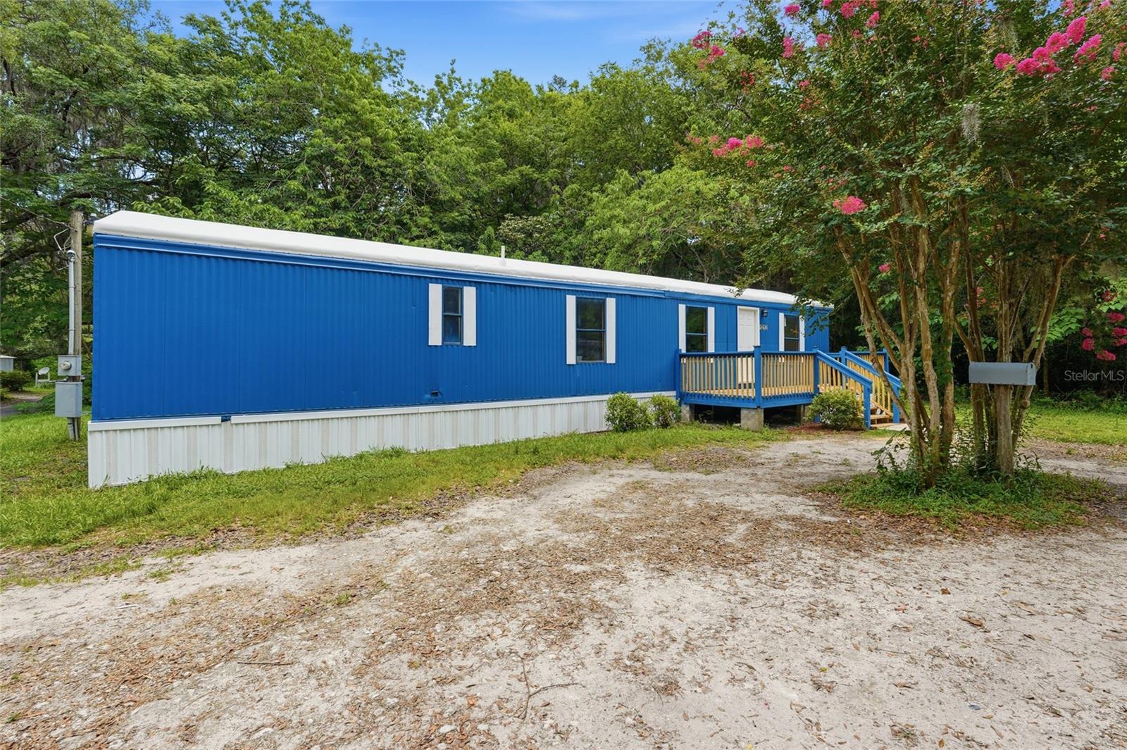 Completely renovated and move-in ready! This beautifully updated 1989 mobile home sits on a spacious corner lot in the heart of Williston and has been fully remodeled from top to bottom in 2026. Features include a brand new metal roof (2026), brand new HVAC system (2026), new kitchen with updated cabinetry and countertops, renovated bathroom, fresh interior and exterior paint, and all new flooring throughout. The home offers a bright and inviting interior along with a large screened-in back porch perfect for relaxing or entertaining. Conveniently located near shopping, dining, and schools while offering affordable, low-maintenance living with modern finishes throughout.