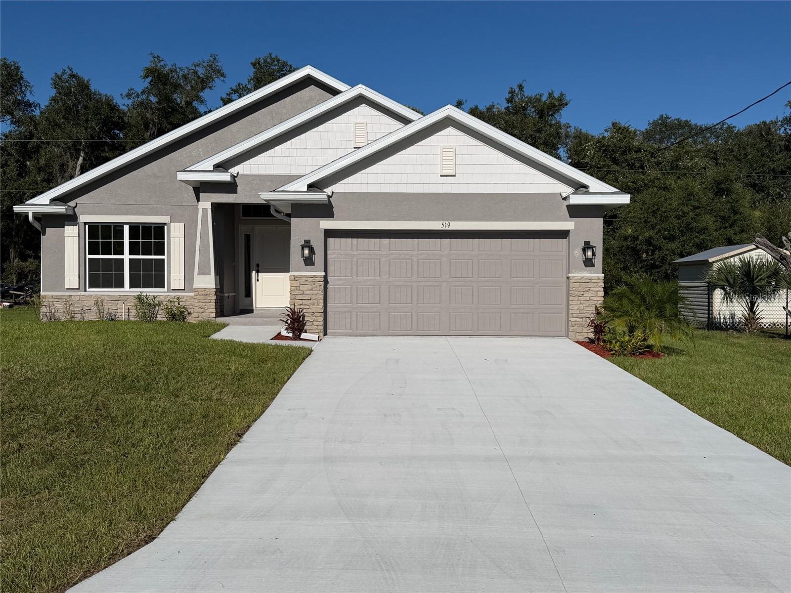 BEAUTIFULLY DESIGNED 3-BEDROOM HOME WITH DEN/BEDROOM # 4, ELEGANT UPGRADES & CLOSE PROXIMITY TO NORTH PORT LOCATION!
Discover the perfect blend of style, comfort, and functionality in this thoughtfully designed home offering 1,820 square feet of living space, 3 bedrooms, 2 bathrooms, a versatile den, and a spacious 2-car garage.
Step inside to an inviting, open-concept floor plan designed for effortless everyday living and entertaining. The kitchen serves as the heart of the home, featuring granite countertops, stainless steel appliances, and abundant cabinetry that combine timeless style with everyday practicality. Beautiful tile flooring extends throughout the home, including all bedrooms, creating a cohesive look while offering easy maintenance.
The flexible den, highlighted by elegant all-glass French doors, provides the perfect space for a home office, reading room, hobby area, or additional retreat tailored to your needs.
Unwind in the spacious primary suite, designed to provide a peaceful escape at the end of the day. The private en-suite bathroom features a beautifully tiled shower and a comfortable, functional layout.
Enjoy your very private Lanai that is enclosed within the footprint of the home. 
Enhancing the home's curb appeal, the upgraded CR elevation showcases attractive stone accents, decorative garage-door details, and distinctive gable accents for added architectural character. Outside, enjoy a landscaped homesite with Bahia sod and an irrigation system, along with the convenience of city water.
This home offers a wonderful balance of residential tranquility and everyday convenience, with shopping and local amenities just a short drive away.
Stylish finishes, versatile living spaces, and a convenient location make this home one to see.