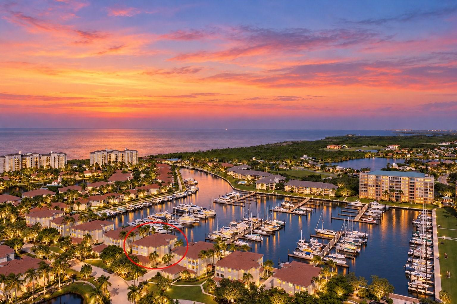 Experience the allure of marina-front living from this second-floor residence, accessed by a private elevator and offered turnkey furnished. This captivating location not only enjoys a heightened sense of arrival but also panoramic views of the north marina basin at Burnt Store Marina. This spacious and versatile layout, scores a “10” with a fabulous open plan bathed in natural light from the abundant windows and doors that surround this elevated condo. Two screened lanais keep you connected with the outside world  and help you to embrace the relaxed coastal lifestyle while enjoying front-row seats to the activity of the marina. The expansive rear lanai stretches across the entire width of the home and features attractive tile flooring, screen enclosure, and captivating views of the marina basin. Whether sipping your morning coffee, enjoying afternoon breezes, or unwinding at the end of the day, this inviting outdoor retreat provides the perfect setting to watch boats cruise in and out of the harbor. Inside, the open and flexible floor plan offers an effortless blend of comfortable everyday living and entertaining space. The kitchen is flanked by two expansive breakfast bars that provide casual seating and gathering areas.  The chef is sure to enjoy the magical cross breeze when they open the sliding doors on either side while whipping up their favorite meal to serve on the lanai Al Fresco style. With ample living space on either side for friends to gather this truly provides a great entertaining venue.  The versatile secondary living area features handsome wood built-in shelving and a cozy fireplace, creating a warm and inviting setting that can serve as a comfortable family room or accommodate a separate dining area. Sliding glass doors open to a second screened lanai at the front of the residence, providing yet another peaceful spot to enjoy the Florida breeze. French doors have been added to connect the third bedroom, which is currently being used as a den. It boasts built-in wood shelving, making it equally suited as a  home office, or for overflow accommodations. The spacious primary suite is a peaceful waterfront retreat, where sliding glass doors frame panoramic views of the marina and provide direct access to the rear lanai. A generous walk-in closet offers ample storage, while the inviting light-filled primary bath offers a contemporary vibe featuring a striking updated frameless walk-in shower with white textured wall tile and pebble flooring.  An oversized vanity with dual sinks, and handsome garden tub surround compliments the vibe lending a fresh feel to the space. Thoughtfully positioned in a separate guest wing, the guest bedroom offers pleasing sunlight through the abundant windows while providing privacy and comfort for visiting family and friends. Convenient access to the updated guest bathroom featuring an handsome tiled shower with a sleek frameless glass enclosure and expansive vanity. The convenient two garage garage adds the ultimate convenience to this sensational condo…perfect for your golf cart, gear and vehicle. Located within the gated waterfront enclave of Sunset Key, this residence places you in the heart of Burnt Store Marina's exceptional resort-style lifestyle. Residents enjoy access to a vibrant boating community featuring the largest deep-water marina in Southwest Florida, along with waterfront dining, a 27-hole golf course, fitness and racquet facilities, and a variety of recreational opportunities.