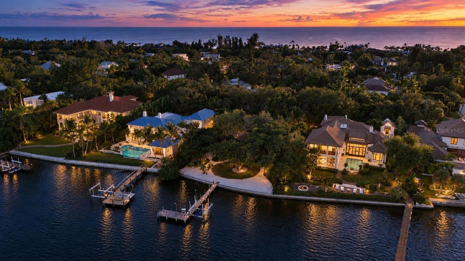 For the first time since 1925, the same Sarasota family is bringing 7535 and 7539 Midnight Pass Road to market, offered together as nearly one acre on Siesta Key. The two parcels total 0.95 acres, with 7535 offering over 100 feet of direct waterfrontage on Little Sarasota Bay, a reinforced concrete seawall, and access to the Intracoastal Waterway.

The main home was designed by Jack West, a celebrated architect of the Sarasota School of Architecture. The charming second home on the adjoining parcel was designed by his onetime partner, Elizabeth Boylston, the first woman in Florida elected to the American Institute of Architects. This second residence offers two bedrooms, one bathroom, and 1,016 square feet, in addition to the MLS-listed totals. A detached two-car garage provides additional parking and storage.

Walls of sliding glass and graceful midcentury lines open the main house to the garden and the water.

Framed by lush tropical greenery, the combined site presents a rare opportunity to create a waterfront compound with a main residence, guest house and gardens. An additional adjacent 0.53-acre lot may also be available for purchase at an additional price, offering an opportunity to expand the property even further.

A 2016 dock with a 13,000 lb boat lift provides access to the Intracoastal Waterway, where mornings begin with soft golden light over Little Sarasota Bay. Turtle Beach, Crescent Beach, and the powder-soft white sand of Siesta Beach are minutes away, with Siesta Key Village, downtown Sarasota, and Sarasota Bradenton International Airport all within easy reach.

For the buyer who has been waiting for the right piece of Siesta Key, this is it: nearly an acre of land with direct bayfrontage, a seawall, dock and lift already in place, complemented by an architectural legacy and history that cannot be replicated. Create the waterfront home you have always imagined on land that has been cherished by the same family for over a century and is now ready for its next chapter.