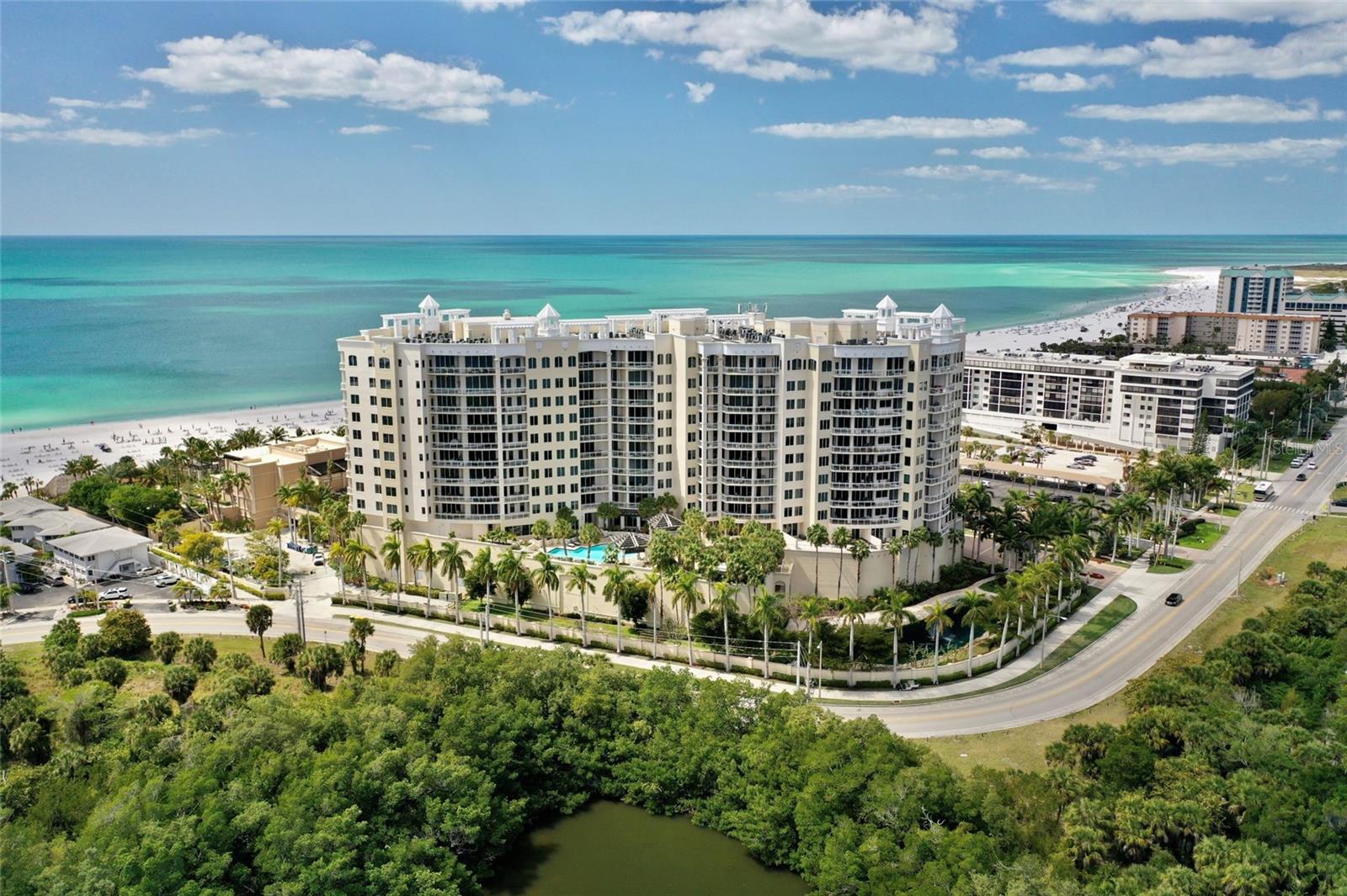 Enjoy this exquisite four-bedroom residence with beach-to-bay and sunrise-to-sunset views. This home in the sky is the pinnacle on the beach at the Ritz-Carlton-managed "THE BEACH RESIDENCES." Unsurpassed luxury, unimaginable legendary Ritz-Carlton services, and a lifestyle where memories are made and dreams are treasured. Enjoy this one-of-a-kind, carefree beach home. From the moment you arrive, you will experience euphoria. Park in the garage and step into your private elevator, which opens into your private residence lobby. You will be mesmerized by the magnificent, ever-changing Gulf of Mexico view & spectacular sunsets. Luxury knows no limits in this stunning home. This residence features a 3,861 sq. ft. split floor plan that maximizes the Gulf of Mexico view through walls of glass and a large wrap-around terrace. Also, enjoy the bayside terrace with epic sunrises and moonrises. Handcrafted interior finishes include beautiful wood floors in the living area, with custom decorator touches. The open floor plan has 2 master bedrooms plus a den/office or 4 bedrooms. This home features a gourmet kitchen with a Décor oven & gas cooktop, Sub-Zero refrigerator, wine cooler, wood cabinets & granite counters, opening to the family room.  "The Name Says It All." Enjoy the best of SRQ in Ritz-Carlton tradition. The Ritz-Carlton's white-glove service is evident at every turn in this enclave. Enjoy the pool and spa, state-of-the-art fitness center, movie theater, game/social room, boardroom, massage room, guest suites & 24/7 concierge services. 2 pets, no weight limit! Walk to St. Armands Circle for boutique shopping/dining. Just minutes to cultural venues of downtown SRQ including theater, opera, museums, shopping & dining. Enjoy watching dolphins from the Gulf Terrace with w/morning coffee and a nightcap on the Bay Terrace to enjoy the twinkling city lights. Have it all, The Best of Both Worlds!
Membership opportunities at The Ritz-Carlton Members Club offer access to additional resort, beach club, spa, dining, and golf experiences; membership is optional and available for an additional fee.