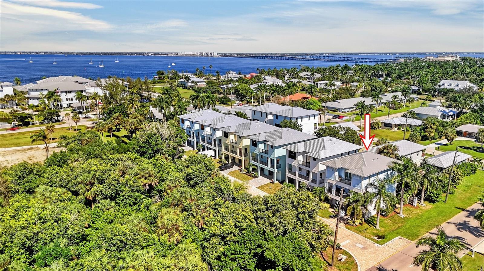 TURNKEY! LUXURY KEY WEST-STYLE HOME IN HISTORIC DOWNTOWN PUNTA GORDA! This 3-bedroom, 2.5-bath, 3-story pool home combines modern coastal design with an exceptional location. Just a 3-minute stroll to famous Southwest Florida sunsets over Charlotte Harbor, Gilchrist Park and Fishermen’s Village. Great income opportunity as short/long term rental or a beautiful home for a permanent residence. Step inside, where a private elevator provides access to all three levels, offering a valuable blend of luxury and everyday convenience. The open-concept second floor features the main living area offering an abundance of natural light, spacious living room opening to 2nd floor balcony to relax or entertain, formal dining area, convenient half bath plus hardwood flooring. The stylish kitchen features custom cabinetry, quartz countertops, subway tile backsplash, Alexa/WiFi-enabled Smart stainless appliances and a breakfast bar ideal for casual dining. The third level is dedicated to the home's private living quarters. Generous primary suite features access to private balcony, walk-in closet, and spa-like ensuite bath with dual vanities and large custom tiled shower. Two additional bedrooms provide space for family or guests, while a full guest bath and conveniently located laundry room complete this level. On the ground level, the outdoor living area features a heated pool and spa surrounded by a paver deck, mature tropical landscaping and wrought iron fencing providing plenty of privacy. The covered lanai highlights an outdoor kitchen with custom-designed barbecue, bar fridge, sink and is complemented by a wood-paneled ceiling. The oversized garage features extra storage space and a rear access door leading directly to the pool area. The metal roof, impact windows and fully automated security system provide peace of mind while the contemporary architecture, stone accents, sleek black railings, and meticulously maintained grounds create attractive curb appeal. Enjoy the convenience of being 6 blocks to downtown Punta Gorda’s finest dining options and nightlife, shopping, arts, and community events. Gilchrist Park, Fishermen's Village, the Yacht Club and Charlotte Harbor are all nearby. With its three-story design, private elevator, balconies, pool and spa, and downtown location, this home offers a unique opportunity to enjoy the Punta Gorda lifestyle. Schedule your private showing today!