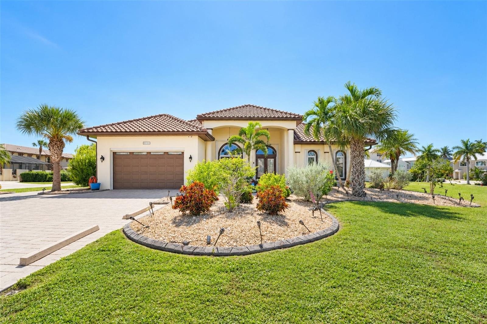 A Fascinating Home Located In The Heart Of Desirable Punta Gorda Isles!! **CLICK ON VIRTUAL TOUR** Enjoy a Delightful and Relaxing Walk or Bicycle Ride with Outstanding Sunsets & Water Views to Fisherman’s Village…What A True Tropical Life Experience!! Features A Stunning Front Entrance with Marble Flooring! The New Elegant & Modern Light Fixtures are Exceptional! Gather, Entertain & Celebrate in this Spacious Piece of Paradise Home Offering a Convenient Split Floor Plan Layout Overlooking the Magnificent Heated Pool and Spa with Fun Waterfalls, a Designated Outdoor Half Bath for your Pool Guests & Travertine Flooring! This Home Provides so much Comfortability with Three Sizable Bedrooms, Two Full Bathrooms, Formal Living and Dining Rooms, A Family Room, A Dinette Area, Inside Laundry Room with a Sink & Closet for all the extras! Fall In Love with This Gorgeous Gourmet Custom Made Kitchen and its Unique Features as the Fabulous Kitchen Island, Built in Coffee Maker, Wood Cabinetry, Outstanding Top of the Line Granite Countertops, Remarkable Back Splash & a Walk In Pantry! The Splendid En-suite Bathroom has a Garden Tub, A Walk-In Shower, Two Separate Sinks, A Makeup Counter & so much Closet Space! The Third Bedroom is Well-Suited to a variety of needs having a Murphy Bed, a Great Built in Desk w/shelving plus a Closet!    ***UPDATES/UPGRADES done within the last 5 Years Include: Refrigerator, Stove Top Range, Built-In Coffee Maker, Tiled Back-Splash in the Kitchen, Wood Plantation Shutters, Water Softener,  GENERAC Generator for the entire house, Pool Pump, Pool Heater, Irrigation System, Tile Roof, Garage Door Screen***   The Enchanting City of Punta Gorda is where you will experience a relaxed waterfront living and boating lifestyle with restaurants, bars, ice cream parlors, live entertainment, shops, parks, outdoor creations & a Distinguised Historic Downtown all surrounded by waterfront views!! Punta Gorda Airport with flights to over 50 destinations & the Florida International Air Show..such a thrilling event happening yearly is approximately 10 minutes from this home.. The CHARLOTTE SPORTS PARK an 82-acre park is the Spring Training Home of the Tampa Bay Rays & is approximately 25 minutes away!! Create Unforgetable Memories visiting Spectacular Boca Grande and Englewood Sandy BEACHES which are only within an hour drive!! Buyer is to do its own diligence and verify all information pertaining to this listing/property!! This Location Is Truly Breathtaking, Offering Unparalleled Beauty and Charm!!