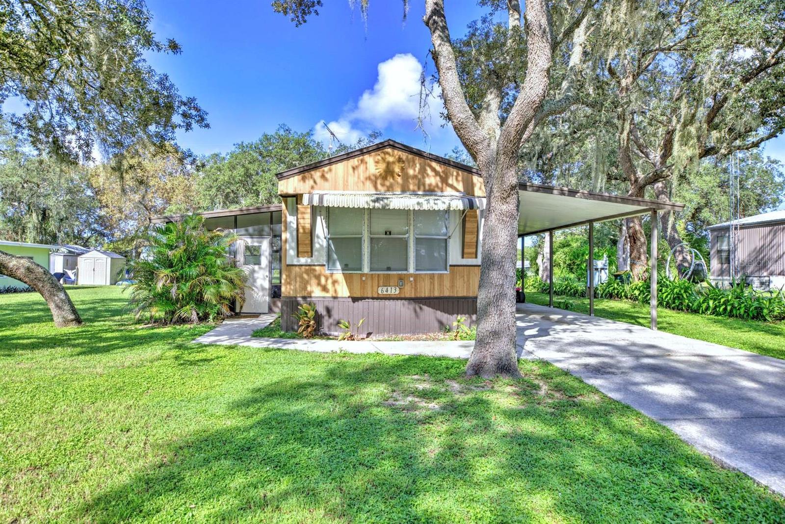 Nicely maintained 2-bedroom, 2-bath mobile home situated on a spacious double lot! This home offers a flexible bonus room that could easily serve as a third bedroom, home office, hobby room, or additional living space. Large screened porches on both sides of the home provide plenty of room for relaxing, entertaining, and enjoying the Florida weather year-round. With its well-kept condition, versatile floor plan, generous outdoor living areas, and the added space of a double lot, this property has plenty of features. Schedule your showing today!