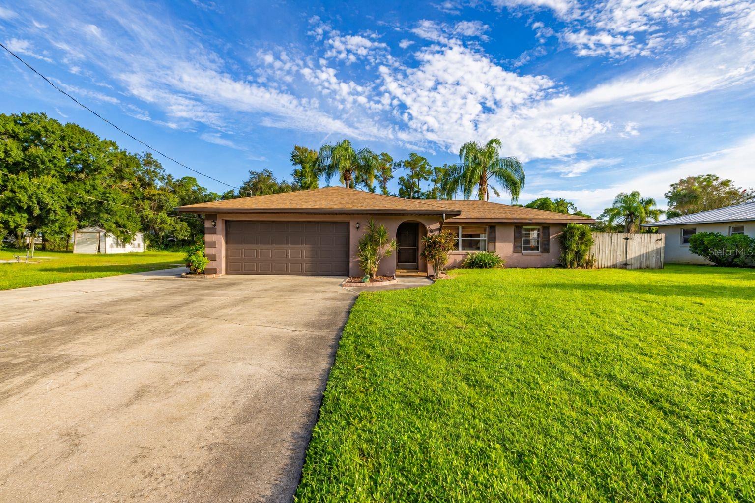 Welcome to a waterfront pool home in the Leisure Lakes Canals community of Lake Placid. Situated on a 0.26-acre lot with approximately 80 feet of waterfront, this single-story concrete block home offers 2 bedrooms, 2 full baths, 2 half baths, 1,361 square feet of living space, and an oversized 2-car garage. There is no HOA, giving you more freedom to enjoy your Florida lifestyle. Inside, the home offers a comfortable layout with separate living, dining, and family areas, providing plenty of room to relax or entertain. The spacious family room overlooks the outdoor living area, while the kitchen is conveniently positioned at the heart of the home. The primary bedroom measures approximately 14' x 14', with a generously sized secondary bedroom for guests, an office, or additional living needs. Step outside and enjoy what makes this property special—a screen-enclosed fiberglass swimming pool and waterfront backyard designed for enjoying the Florida sunshine. Beyond the pool, the property features a private dock, boathouse, seawall/bulkhead, and owned boat slip, making it easy to enjoy boating, fishing, and days on the water right from your own backyard. A shed/workshop provides additional storage and workspace. Additional features include a 2018 shingle roof, central electric heating and cooling, private well, septic system, screened rear porch, and oversized garage. Whether you're looking for a full-time residence, seasonal Florida getaway, or a waterfront home where you can enjoy the pool and water year-round, 3011 Waterway Drive offers a great combination of indoor space, outdoor living, and direct waterfront access.