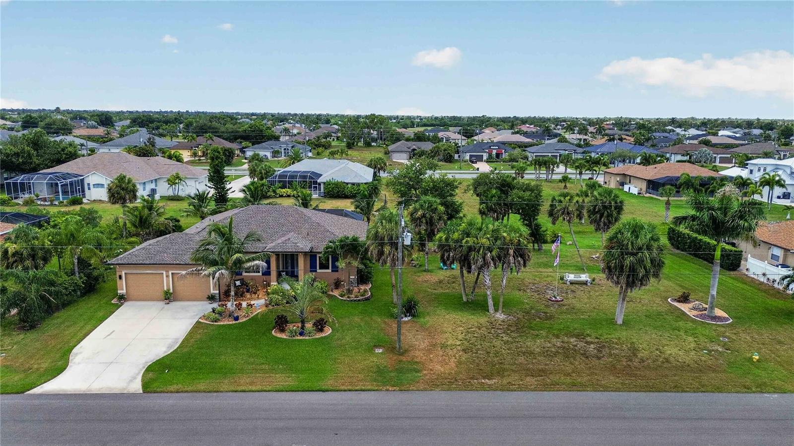 THIS "BETTER THAN NEW HOME" with ADDITIONAL LOT has been meticulously maintained and is ready for YOU! This custom home offers a myriad of quality features and details including high ceilings with 8 ft tall doorways, plantation shutters, upgraded lighting, and more! As you view the elegant landscaping with stone and custom curbing while walking up to the 8' high, double glass doors and step into the foyer, you know this home is going to be everything you want… and more! A spacious "great room" greets you a warm, neutral color scheme, easy to maintain tile flooring that continues throughout the entire home, and a view of your private pool. 

With the open floor plan you can view the spacious kitchen accented by recessed lighting, quality wood cabinetry, stunning granite countertops, under cabinet lighting, and quality stainless steel appliances including a new range and refrigerator (2025). The roomy dining area with a designer light fixture, is ideally located near the kitchen & living room where you can gather with friends and family with a home cooked meal. All of this provides eye-catching views of your surroundings through two sets of sliding glass doors -- opening the house to your amazing personal outdoor retreat with brick-pavers, including a spacious covered lanai (30' x 10') and an additional (13' x 7') covered area providing ample seating areas with ceiling fans, and the screened enclosure with your electric heated, saltwater pool with Pebble Tec interior.  

And there is plenty of room inside this home! With a “split” bedroom plan, the primary suite is separate with a large bedroom, tray ceiling, sliders with custom plantation shutters that lead out to the pool area, two closets, and the ensuite bathroom with dual sinks, stunning granite countertops, a large walk-in shower with tiled walls and floor, plus a linen closet.

On the opposite side of the home, there are two additional oversized bedrooms – both roomy with ceiling fans & the same beautiful ceramic tile that runs throughout the entire home. 

The 2nd full bathroom boasts granite countertops, wood cabinetry a tiled shower with glass doors and a linen closet. Let’s not forget about the private office with french doors, custom lighted ceiling fan, and large window. The large laundry room features quality washer and dryer (replaced in 2025), ample shelving, and utility sink. The OVERSIZED two car garage has epoxy coated floors and MORE shelving for storage! 

Additional updates include: new roof (2025), a freshly painted exterior (2026), exterior soffit lighting, hurricane shutters for all windows & doors, and irrigation for both lots.   
This is a “dream come true” home and a MUST SEE. Rotonda West offers walking/biking trails, freshwater canals for kayaking or fishing, 5 golf courses, and is just minutes from tropical beaches, boating, dining, shopping and so much more! Don't miss this incredible opportunity to call this HOME.