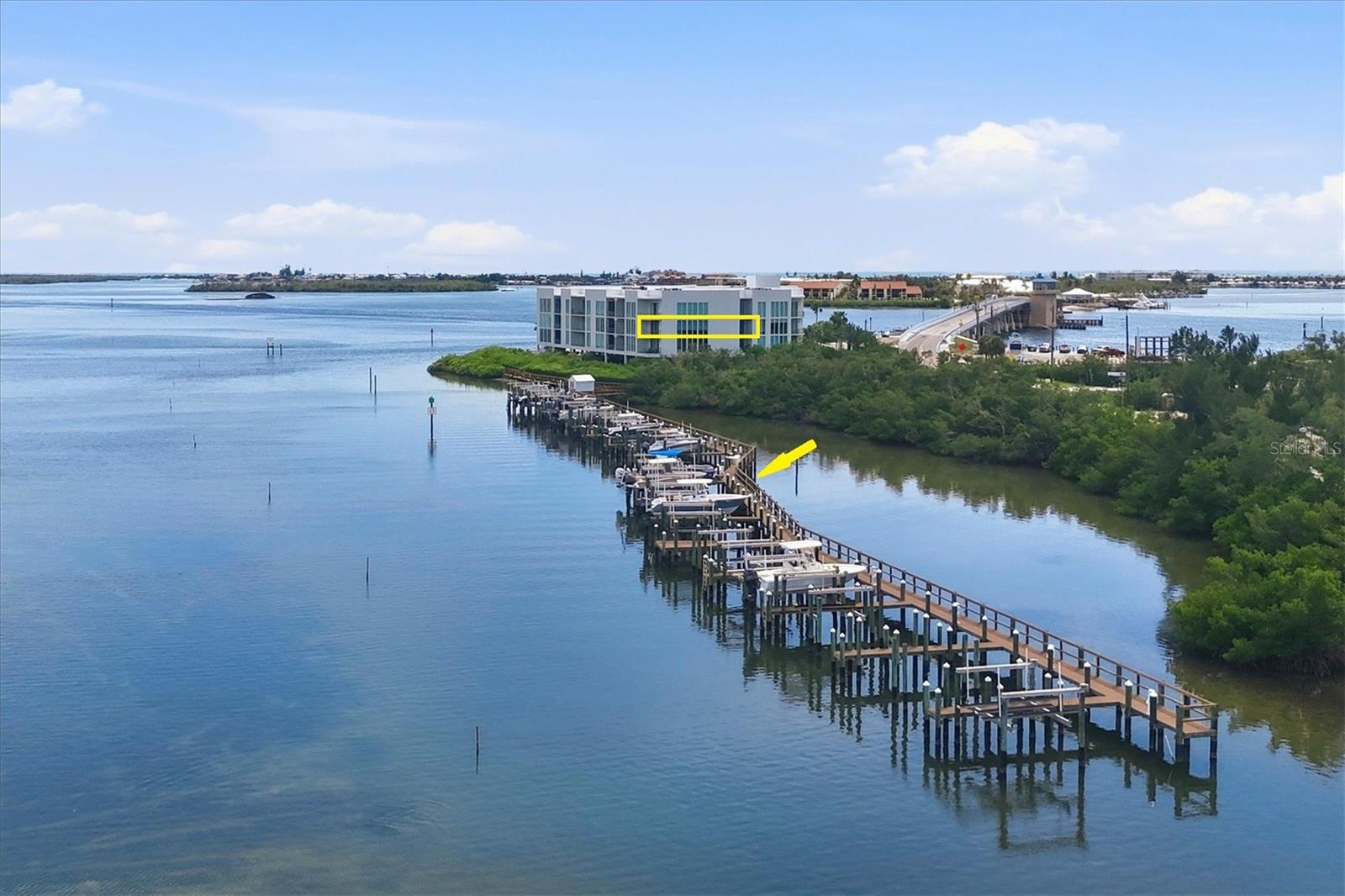 LUXURY WATERFRONT CONDOMINIUM WITH BOAT SLIP AND 10,000lb LIFT, LESS THEN ONE MILE TO MANASOTA KEY BEACH. This 2 bedroom plus den and 2 bathroom condominium is located in Redfish Key Villas, a 35 unit, 2007 built all concrete building with hurricane impact windows and sliders and a new 2024 roof! Enjoy an onsite boat slip (included with purchase) with a 10,000lb lift and easy access with no bridges to the ICW and Gulf of Mexico via Stump Pass. A short walk or bike ride over the Tom Adams Bridge brings you directly to the sandy beaches and lively restaurants and nightlife of Englewood Beach on Manasota Key. The condo is tiled throughout with luxury vinyl flooring in both bedrooms, 12 ft ceilings with soaring 10ft sliders and windows overlooking Lemon Bay and two water facing terraces! Detailed with custom wood cabinetry, granite countertops throughout and stainless steel appliances. Other amenities include a waterfront heated pool, covered parking, an owner’s storage closet and kayak storage. Call now for your tour of this magnificent waterfront property!