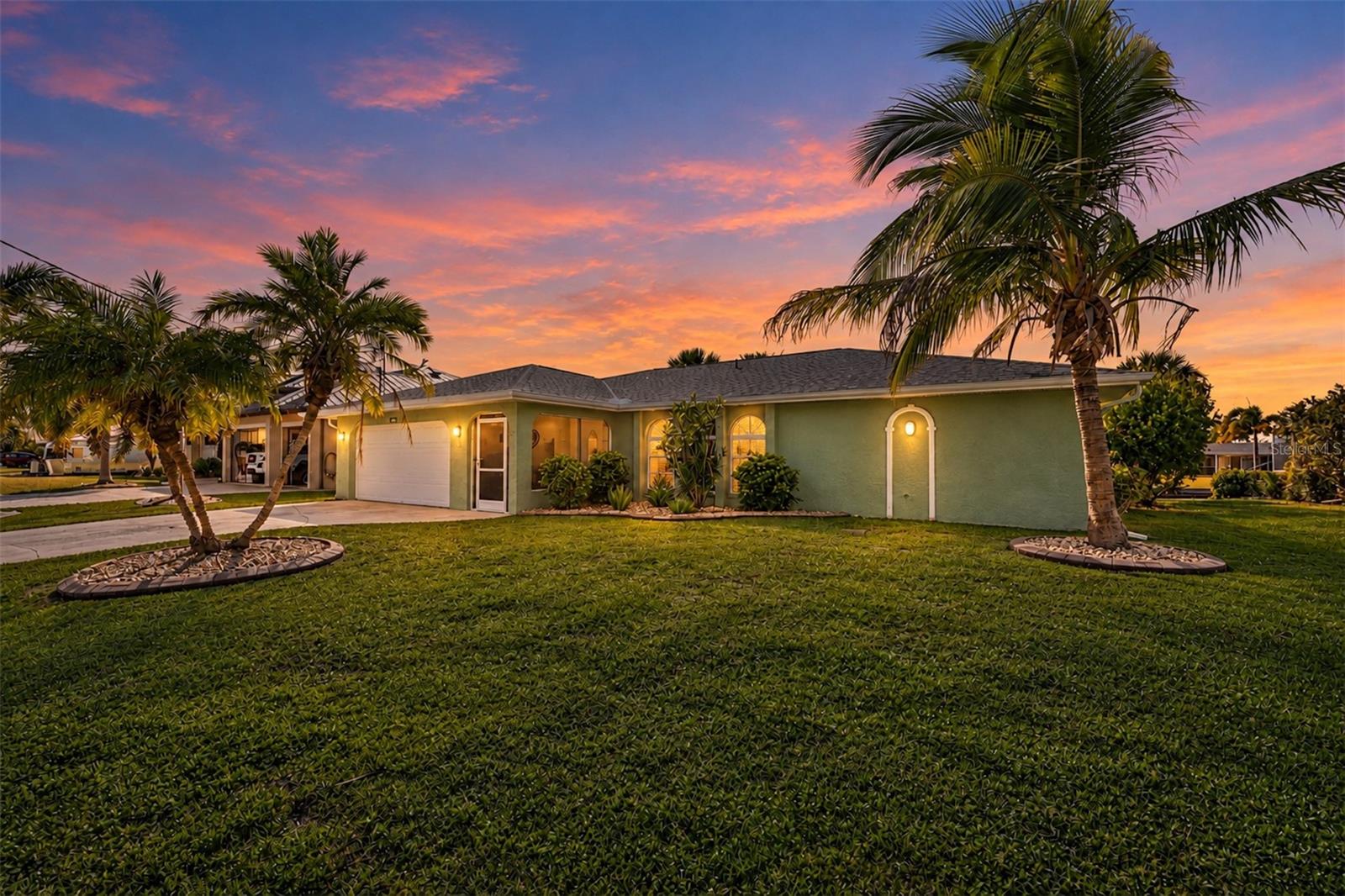 Discover a relaxed waterfront lifestyle at 18231 Hottelet Circle, where peaceful canal views, a private backyard, and inviting indoor spaces come together. This three-bedroom, two-bath, 2 car garage home features a split-bedroom floor plan, with the primary bedroom privately positioned on one side and two spacious bedrooms on the other—offering a comfortable sense of separation for family and visitors.

The recently upgraded kitchen pairs beautiful quartz countertops with abundant neutral-toned cabinetry and generous workspace for meal preparation, serving, and gathering. The newly designed laundry room adds everyday convenience with extensive cabinetry and countertops to help keep household essentials organized.

Step outside to a spacious pool deck overlooking the saltwater canal, with plenty of room to lounge, dine, or entertain. The westerly exposure sets the scene for gorgeous sunsets over the water. For boating enthusiasts, the property includes a 10,000-pound boat lift and davits, with one bridge along the canal route. Beyond the pool, the private backyard offers a tropical touch with mango and lime trees and pineapple plants. Pool has been resurfaced. 

An audio system extends throughout the home and onto the lanai, making it easy to enjoy music as you move between indoor and outdoor living. 
From peaceful mornings by the canal to sunset evenings beside the pool, this home offers a welcoming place to enjoy the Florida waterfront lifestyle.
