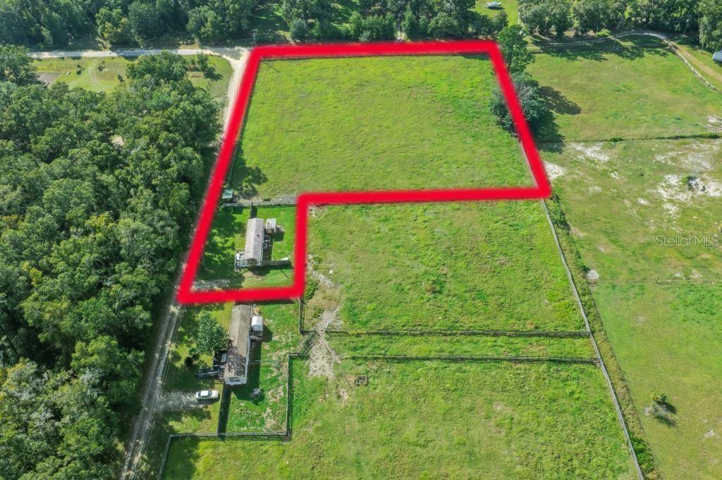Bring your mini farm dreams to life on this 2.19 acre agricultural zoned property tucked away in a quiet, peaceful area of horse country, while only approximately one mile off a paved road! Fully fenced with a pasture, this property is ready for your horses, goats, chickens, and more. With no HOA or deed restrictions, you can enjoy the freedom and flexibility to create the property you’ve been dreaming of.    The property includes an existing 672 sq. ft. single wide with 2 bedrooms and 1 bath that will require extensive remodeling or could be used for additional storage.    One of the standout features is the potential to accommodate up to two homes, including site built single family homes, manufactured homes, or mobile homes. Bring your builder and explore the possibilities for creating your own private mini farm. Looking for even more space? There is an opportunity to purchase an additional 1.22 acres adjacent to this property for $119,000, contact the listing agent for additional information.    Equestrian enthusiasts will appreciate the convenient location, just 7.2 miles from the World Equestrian Center and 12 miles from HITS. Enjoy the peaceful country setting while remaining close to two of Ocala’s premier equestrian destinations. Whether you’re looking for a place for your animals, room to build, or an opportunity to create your own small farm, this property offers plenty of potential! (Please note: This property is also listed as a home for sale under MLS #OM734452.)