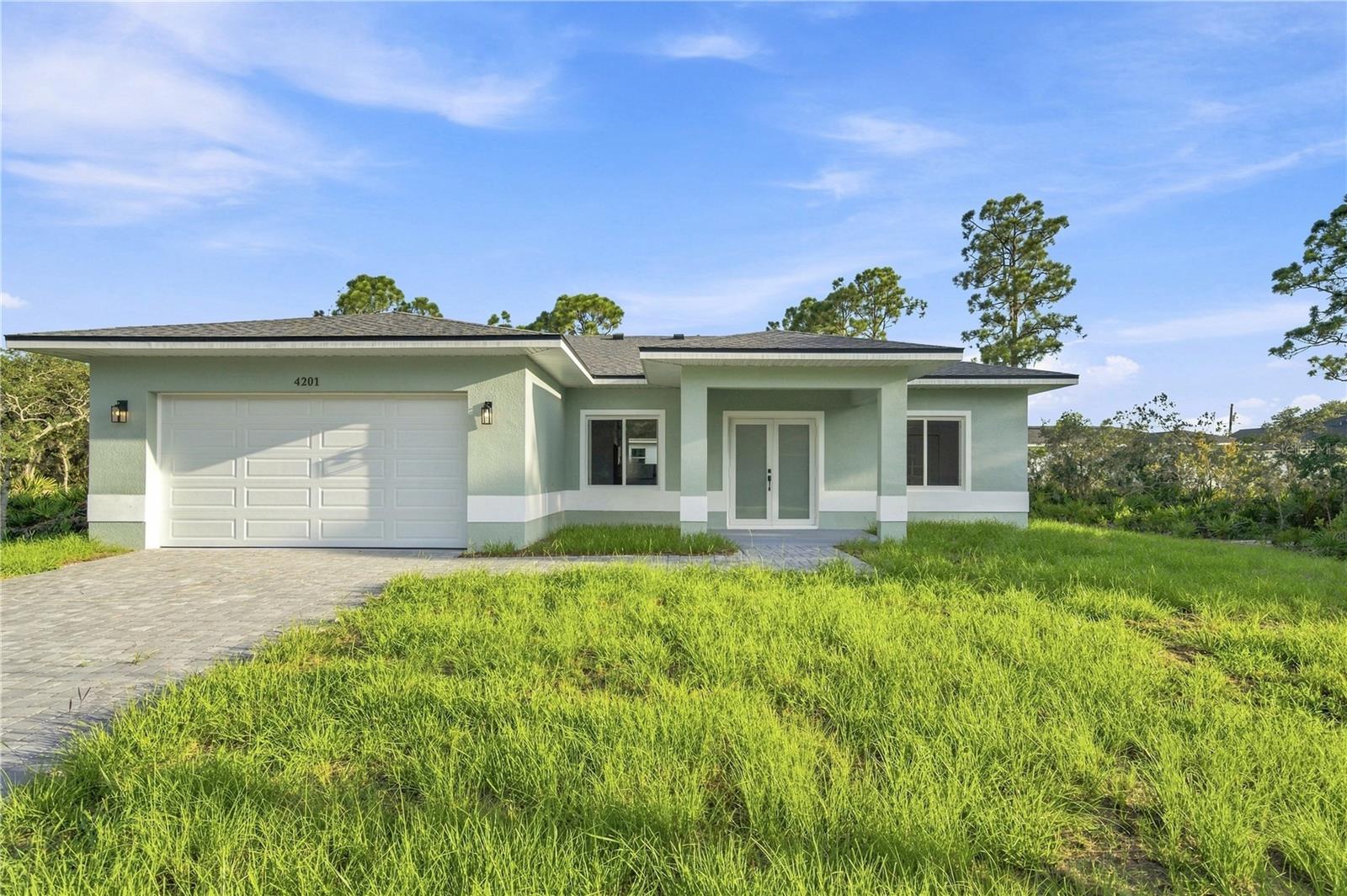 Virtually Staged. A rare opportunity to own a brand-new home on a private lot in Sebring Country Estates. This beautifully designed 3-bedroom, 2-bath home offers a modern open-concept layout with 9-foot ceilings and a bright, spacious great room ideal for everyday living and entertaining. The kitchen is the centerpiece of the home, featuring a large island, stylish finishes, and plenty of space for cooking and gathering. The thoughtfully designed split-bedroom floor plan provides comfort and privacy, with a spacious primary suite that includes a walk-in closet and private bathroom. Additional highlights include a covered rear lanai perfect for relaxing outdoors, a dedicated laundry room, and a two-car garage. Seller will provide and install a washer and dryer before closing or offer a credit toward their purchase (see Broker Remarks for details). Situated on a premium lot with exceptional privacy and no immediate neighbor on one side, surrounded by natural vegetation that creates a peaceful and private setting. Located in the desirable Sebring Country Estates community with convenient access to shopping, dining, golf courses, and Sebring’s beautiful lakes.