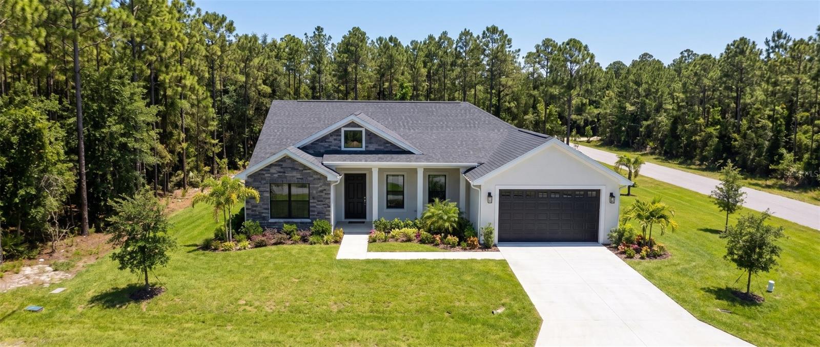 Take the first step toward your new home! This one-acre lot in Rainbow Lakes Estates, Dunnellon, is nestled in a beautiful, growing community offering tranquility, natural surroundings, and convenient access to shopping and recreation. Enjoy access to historic downtown Dunnellon, Walmart, Publix, restaurants, shops, Rainbow Springs State Park, the World Equestrian Center, downtown Ocala, and I-75. 

The sale includes a survey, site plan, and plans for a beautiful single-story residence featuring 2,207 total square feet of construction, three bedrooms, two bathrooms, a two-car garage, covered front porch, and lanai. The proposed home features concrete block construction, vaulted ceilings in the living room and kitchen, an attractive exterior, and planned finishes such as wood Shaker cabinets, granite, quartz, or marble countertops, marble-look porcelain tile or waterproof wood-look vinyl flooring, and stainless steel kitchen appliances. 

The package includes plans submitted to Marion County and coordination of the building permit process. Once the plans are approved and the permit is issued, the buyer will receive the approved plans and corresponding building permit. An excellent opportunity to own your land with the planning and permitting process underway for your future home. Home construction is not included.