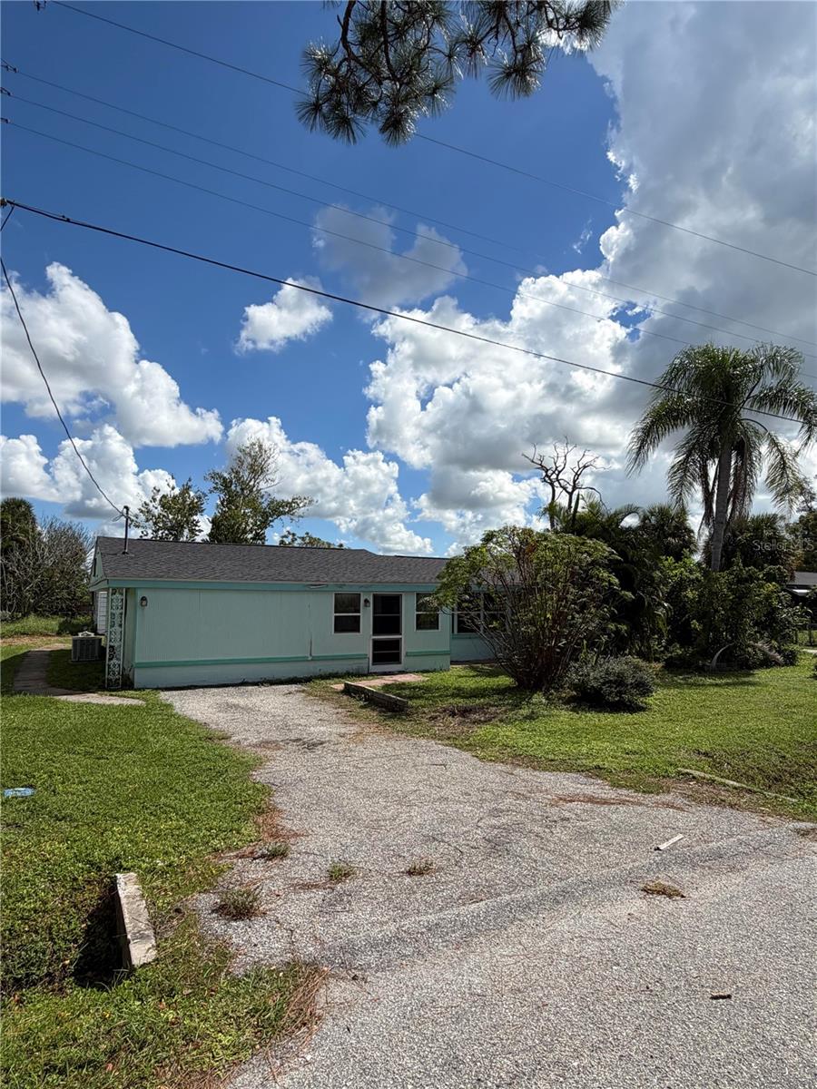 Looking for a comfortable 3/2 home with over 700 SF of outbuildings at an affordable price?  Then you need to see this home.  New roof, HVAC system. flooring and power panel updates before current owner ran out of steam. It still needs bathrooms completed, kitchen and appliances so this home is not going to be financeable until completed.  This home is situated on an oversized lot with city water and sewer connected and less than a mile from Old Englewood Village.  There is a second driveway to the buildings in the back yard.  One is a frame building with a new roof and entry doors on both ends, high ceilings and drywall inside, concrete hardy board on the outside.  The other is a large metal storage building with washer/dryer hookups. Combined these two outbuildings give you 768 SF of shop, work from home, hobbies or storage space.  Long story short, if you have the cash and are not afraid of a kitchen remodel this property offers a lot of value for the money, call today!