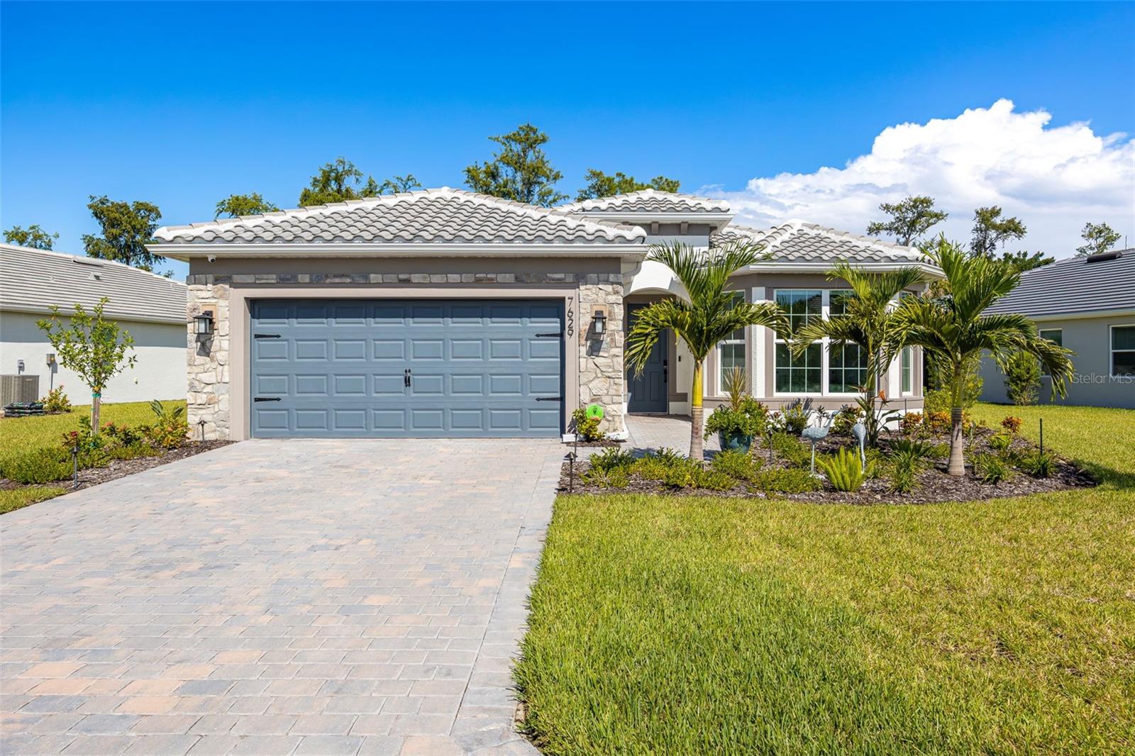 This home is built on the Mystique floor plan, one of the most sought-after layouts at Del Webb Oak Creek, and upgraded with a desirable third bedroom option, giving you more flexibility than the standard plan offers. This particular home has also been upgraded from top to bottom, inside and out. Built in 2025 and situated on an XL premium lot with pristine preserve views, it offers 2,084 square feet with three bedrooms, two full baths, and a versatile den. Step inside and the upgrades speak for themselves. Luxury plank vinyl flooring runs throughout, paired with upgraded cabinetry, custom wood beams in the living room and primary suite, and a beautifully finished shiplap accent wall in the master. The kitchen is outfitted with upgraded KitchenAid appliances, a large island, and a walk-in pantry with custom closet upgrades, while the primary suite offers its own upgraded closet system for maximum storage. Comfort and peace of mind are built in at every level: a whole-house Bluestream water filtration system, upgraded HVAC with UV light purification, insulated garage door and attic, electric blinds, upgraded lighting throughout, sonos system, and a full security and camera system. The garage impresses with an epoxy floor and a dedicated mini-split system, plus a pull-down attic ladder for easy access and extra storage. Out back, the pool package transforms the screened lanai into a private oasis, complete with outdoor speakers for entertaining or unwinding in style. Beyond your front door, Del Webb Oak Creek brings resort-style living to active adults in North Fort Myers. This gated community has a clubhouse, an on-site restaurant, a resort-style pool with an attached lap pool, an attended fitness center, pickleball and bocce courts, and a dog park. The social atmosphere is warm and welcoming, with activities built right in and everything else just minutes away.