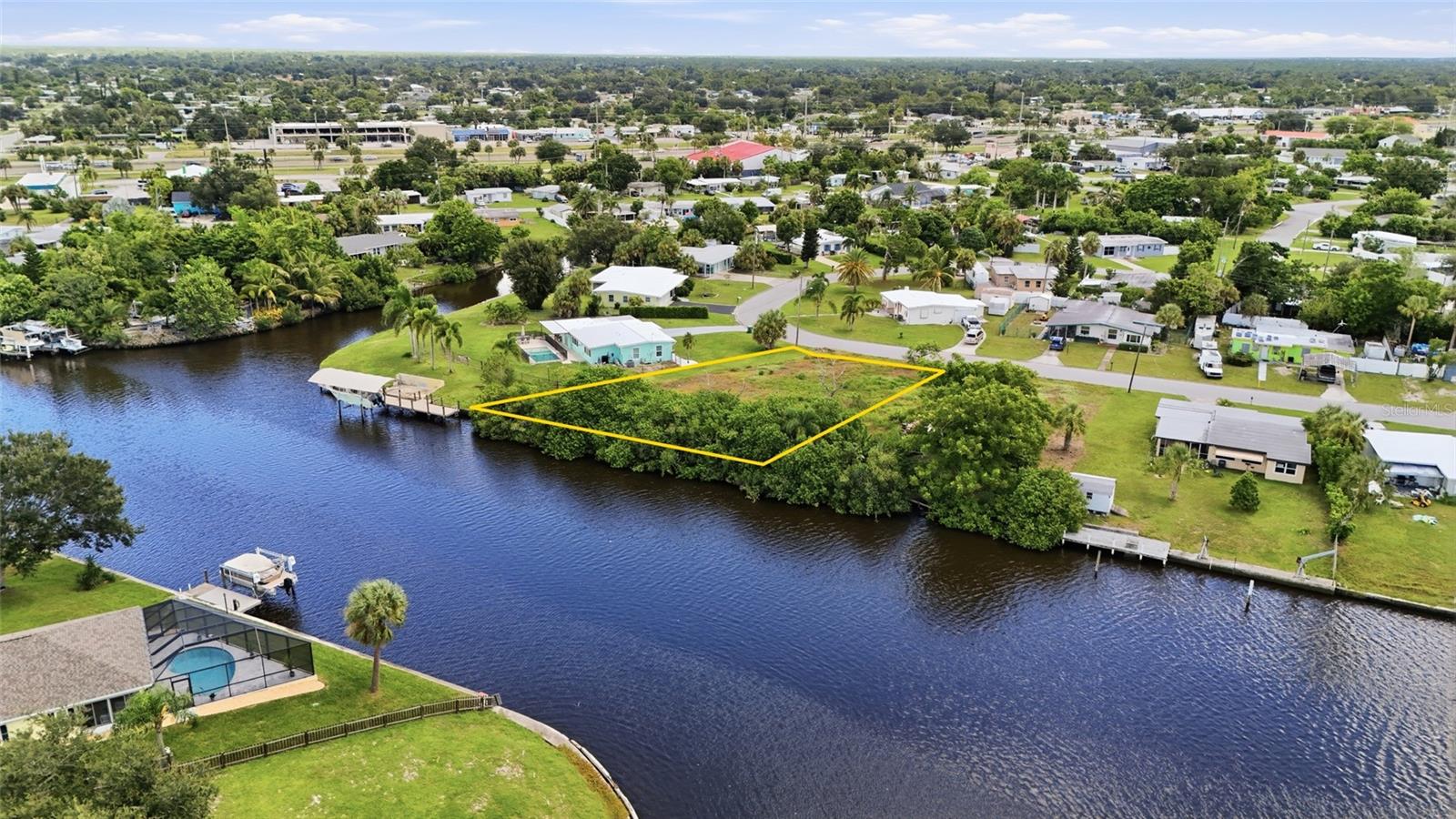WATERFRONT BUILDING OPPORTUNITY WITH POWERBOAT ACCESS! Bring your dream home plans to this exceptional waterfront property  in Port Charlotte. Boasting approximately 140 feet of seawall, this tiplot offers an incredible waterfront setting with 13 feet of depth in the middle, providing plenty of room for boating and waterfront enjoyment.

The property features western exposure and an intersecting canal view, creating an expansive waterfront backdrop and the potential to enjoy beautiful sunsets from your future home or outdoor living space. With powerboat access and just minutes to Charlotte Harbor, you can spend less time navigating canals and more time enjoying the open water.

Located in an established Port Charlotte neighborhood, this is a rare opportunity to build your own waterfront retreat in a location that puts boating, fishing, dining, and Southwest Florida's coastal lifestyle within easy reach.