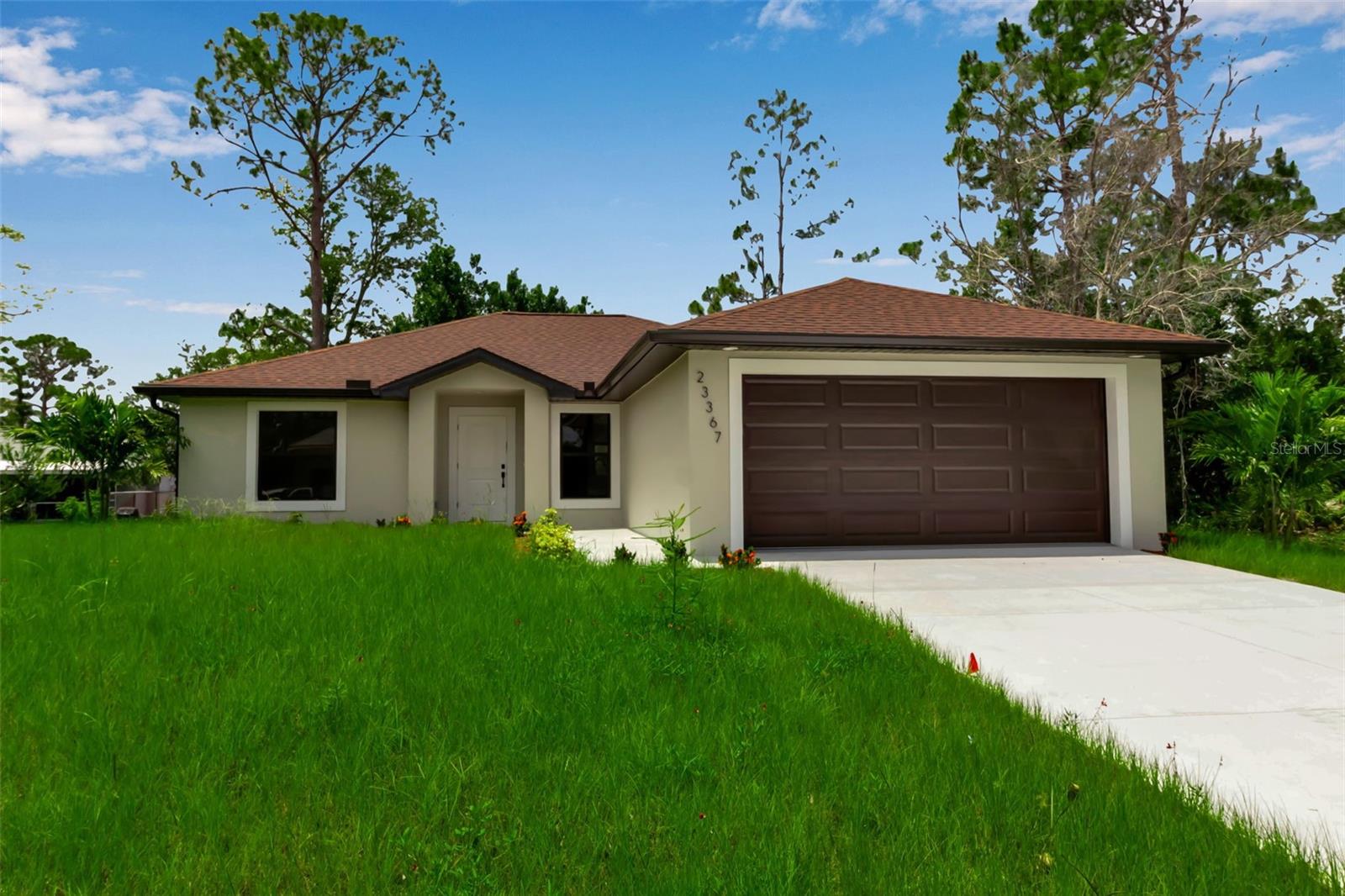 Welcome to 23367 Mayville Avenue, a newly built 4-bedroom, 2-bath home in a quiet, no-HOA Punta Gorda neighborhood. The bright, open floor plan features ceramic tile flooring throughout, vaulted ceilings, and a split-bedroom layout. The kitchen offers stainless steel appliances, quartz countertops, and a breakfast bar, while the primary suite includes a walk-in closet and ensuite bath. Additional features include hurricane-impact windows, a two-car garage, automatic irrigation, and a private backyard with patio. Conveniently located near I-75, shopping, dining, schools, downtown Punta Gorda, and Gulf Coast beaches, this home offers modern comfort and easy access to everyday amenities.