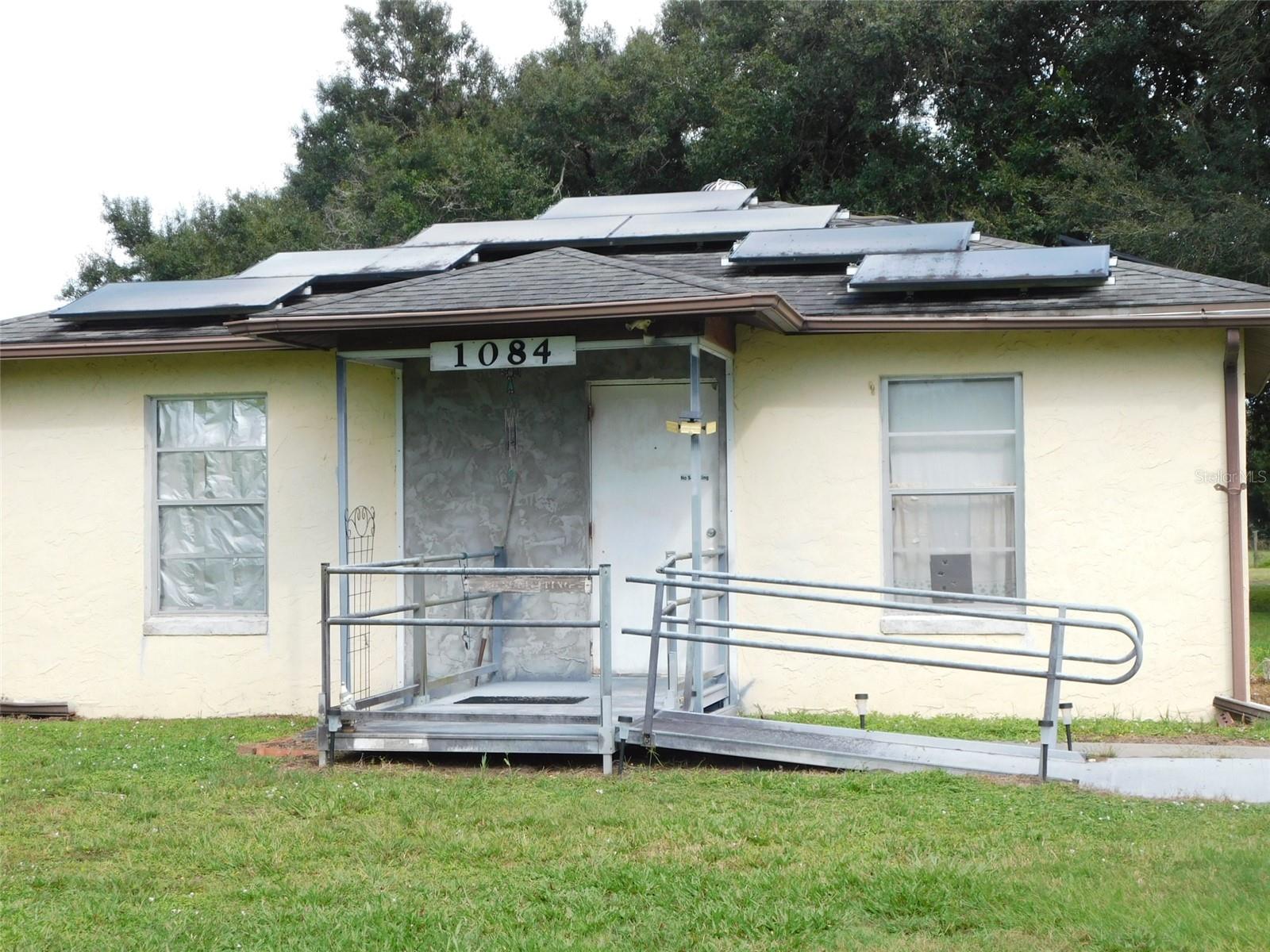 $125,000 FOR THIS CBS 2 BEDROOM 1 BATH HOME, ON .58 ACRE OF LAND.  LIVING ROOM, KITCHEN, LAUNDRY ROOM THAT HAS A COMMODE,  15X23 COVERED BACK PORCH. NEW SHINGLE ROOF IN 2017, SOLAR PANELS IN 2018. OAK TREES, WATER AND ELECTRICAL HOOKUP FOR A TRAVEL TRAILER. RAMP TO THE FRONT DOOR PORCH. THERE IS A CENTRAL AC/HEAT SYSTEM IN THE HOME BUT DOES NOT WORK, NEED REPLACING. PROPERTY SOLD AS IS.
