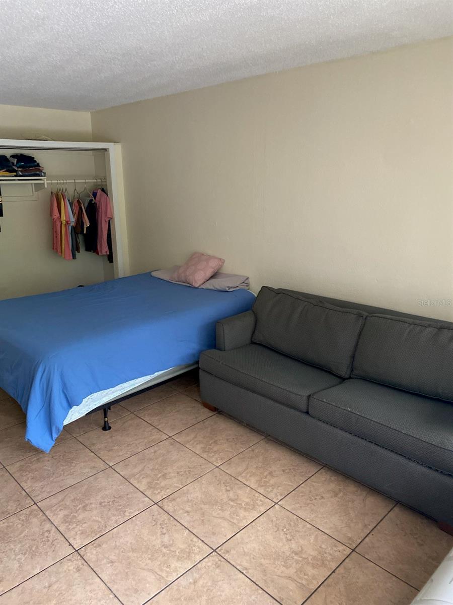 Fully furnished 1 bedroom efficiency with refrigerator and air conditioner with room for a kitchenette. HOA includes: water, electricity, cable tv, trash removal and security. Near shopping, restaurants, attractions, and airport.