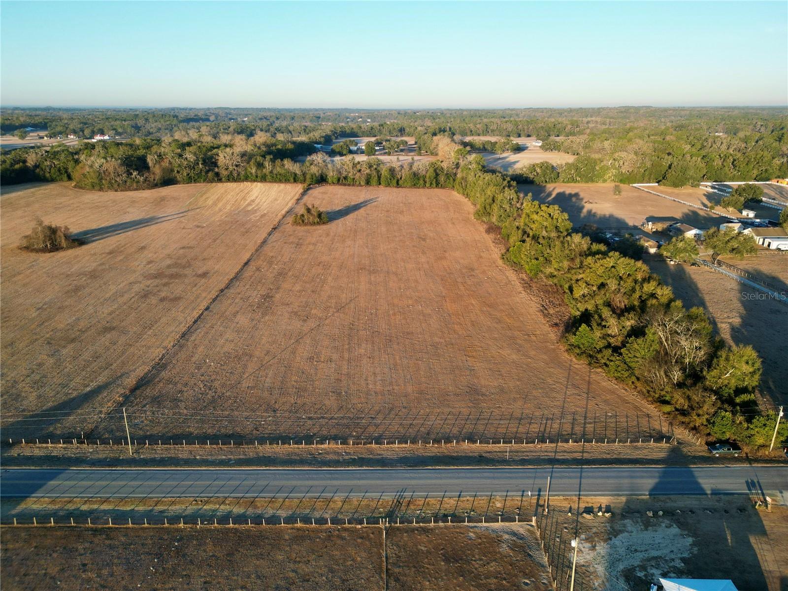 For sale: 12.60 acres of improved, fully fenced pastureland with an active Agricultural (A1) exemption. This beautiful property is a blank canvas ready for your vision, located just five miles to the World Equestrian Center (WEC). Bring your horses and enjoy peaceful country living with frontage on NW Highway 225A and strategic proximity to I-75—approximately three miles away. Don’t miss this rare opportunity to purchase acreage in a highly desirable and accessible location.
