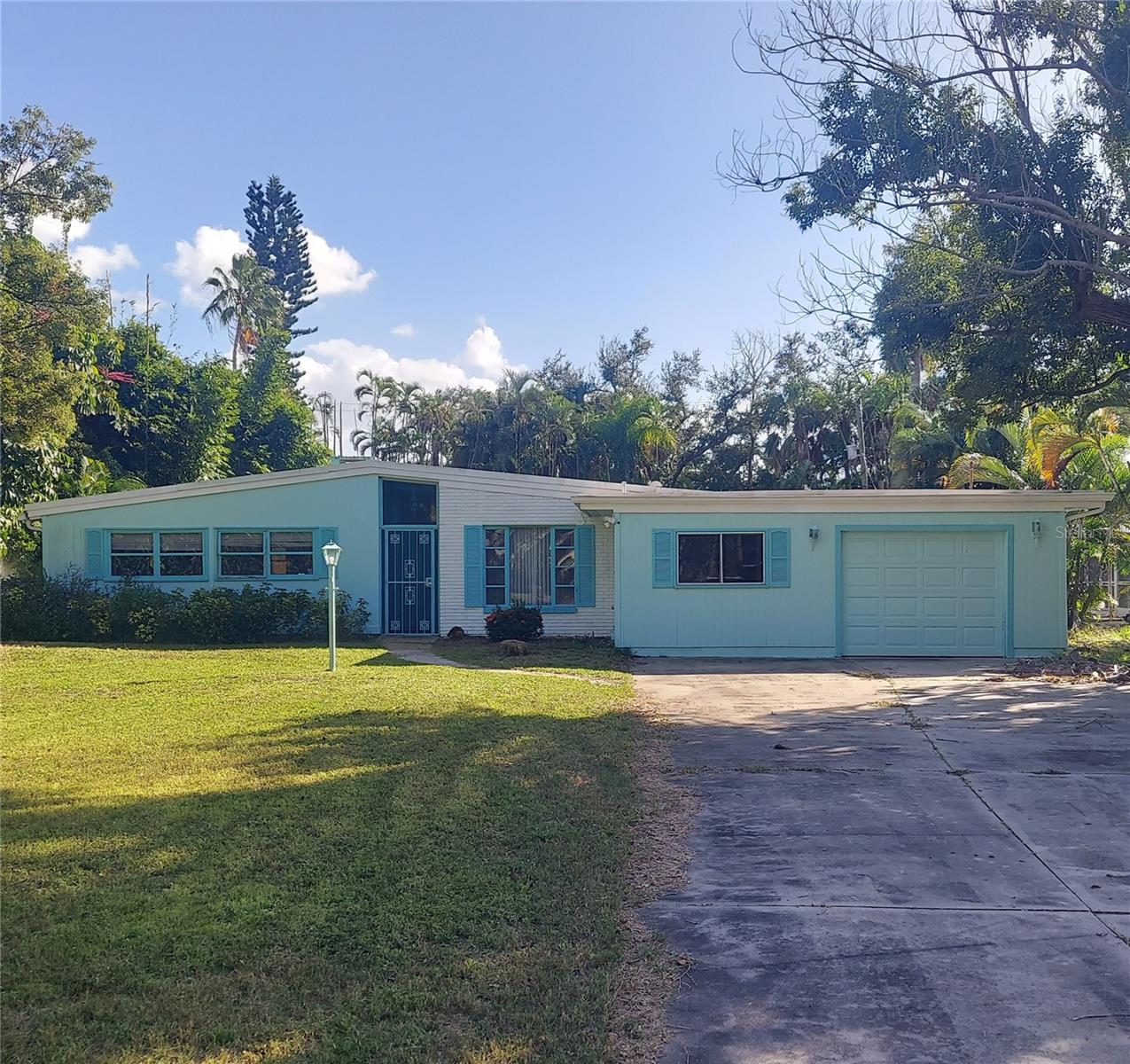 Mid-Century Modern Gem with Pool, Character & Endless Potential in Indian Beach Sapphire Shores.

Bring your vision and creativity to this mid-century modern home in the highly desirable Indian Beach Sapphire Shores subdivision! Offering 3 bedrooms, 2 bathrooms, and a desirable split-bedroom floor plan, this property is full of character and ready for someone with the imagination to restore it to its former glory.

Inside, you’ll find beautiful wood ceilings accented by exposed beams, adding warmth and architectural charm throughout the home. A wood-burning fireplace creates a welcoming focal point, while the in-ground swimming pool and expansive yard offer plenty of space for outdoor living, entertaining, and creating your own private retreat. Partial water views from the rear of the property add another special touch.

This property requires substantial repairs and is being offered cash only, as-is. It presents an opportunity for investors, renovators, or buyers looking for a project with distinctive architectural character, a generous lot, and a desirable location. Utilities have been turned off for some time. Buyer will need to complete inspections prior to making an offer.

With its mid-century modern appeal, spacious grounds, pool, and unique setting in Indian Beach Sapphire Shores, this property offers the opportunity to bring new life to a home with plenty of potential. Bring your contractor and your imagination and explore the possibilities!